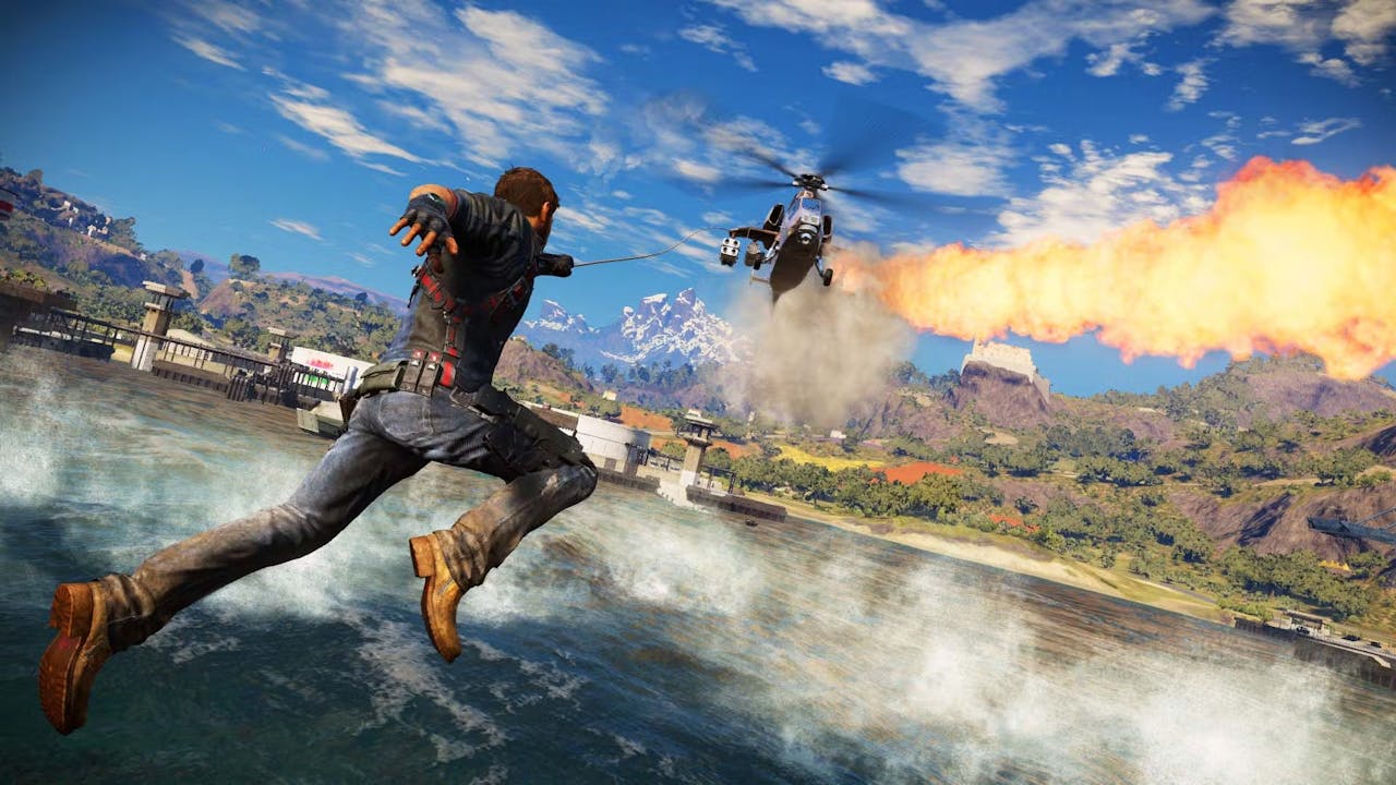 Protagonist Rico Rodriguez grappeling onto a falling helicopter in Just Cause 3.